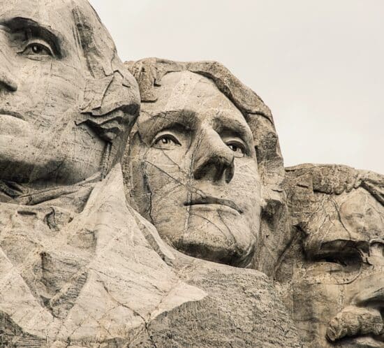 A stylized portrait of the Founding Fathers at Mount Rushmore
